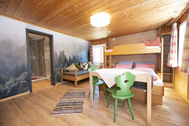 a room with a table and chairs